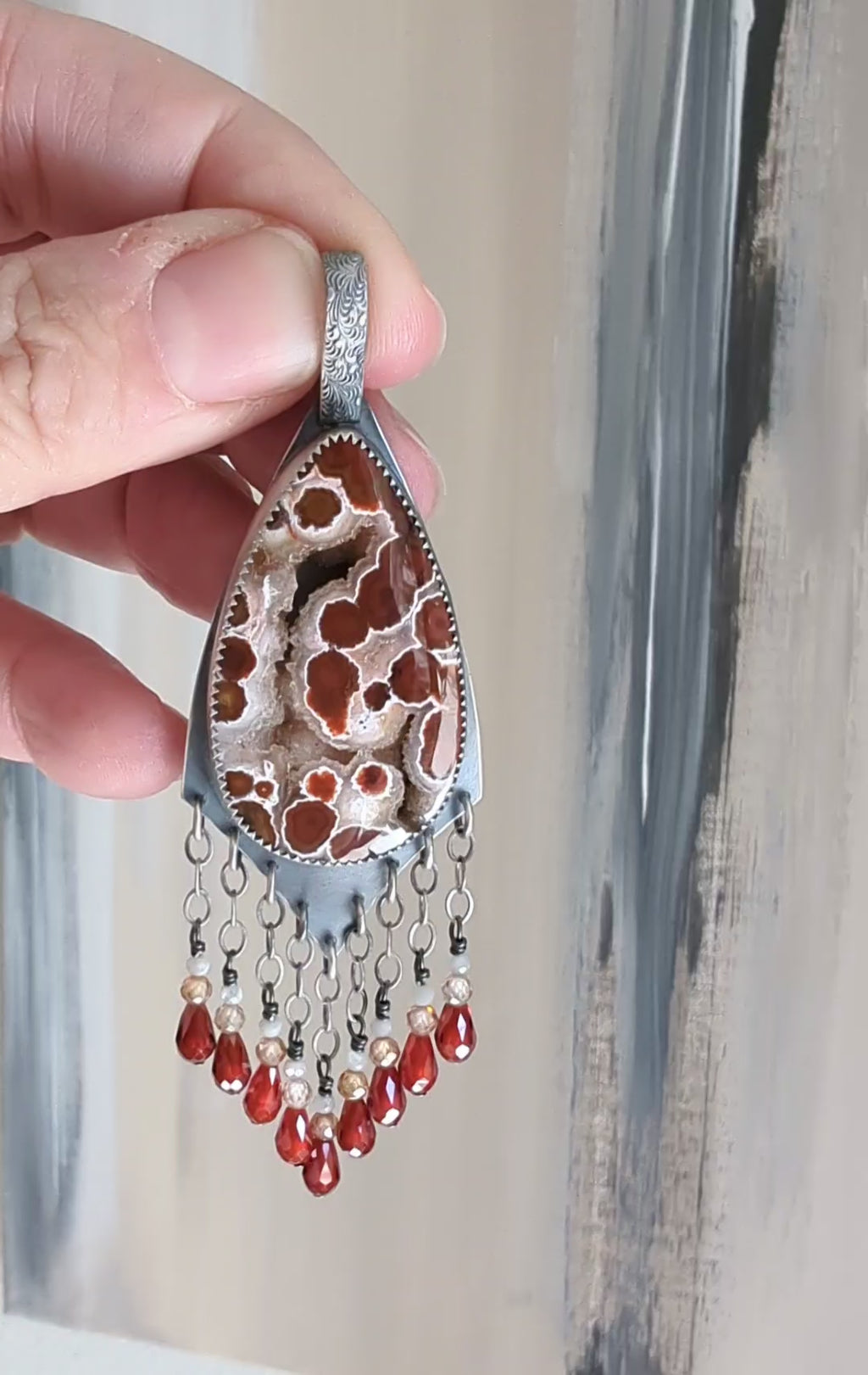 Video of playful luxury pendant with ocean jasper and shimmering detail by Rebellenhaus