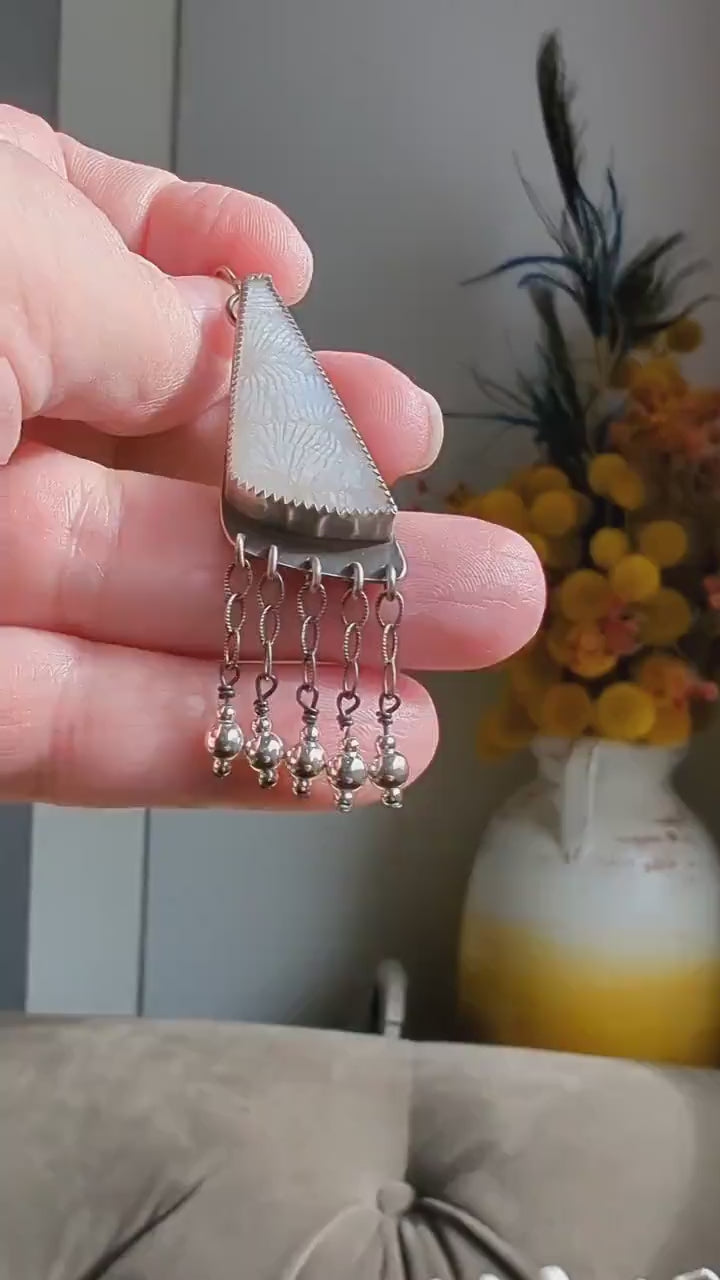 Video of Winter-ready sterling silver earrings with delicate movement