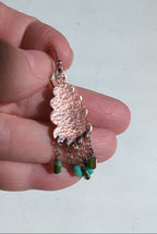 Video of handmade copper earrings with scalloped design and bead fringe by Rebellenhaus