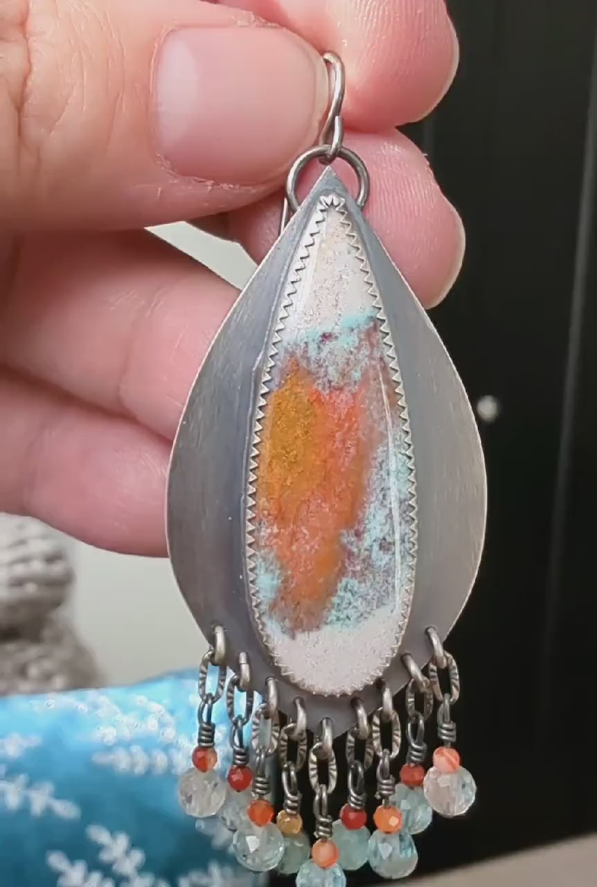 Video of collector gemstone earrings showcasing unique opalized wood variation