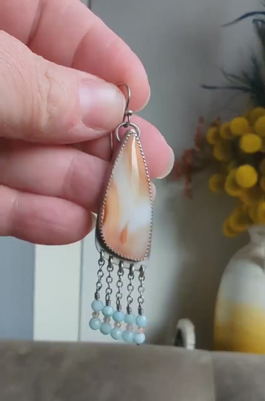 Video of one of a kind orange and white agate earrings by Rebellenhaus