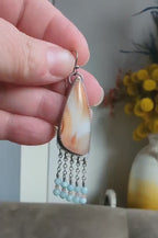 Video of one of a kind orange and white agate earrings by Rebellenhaus
