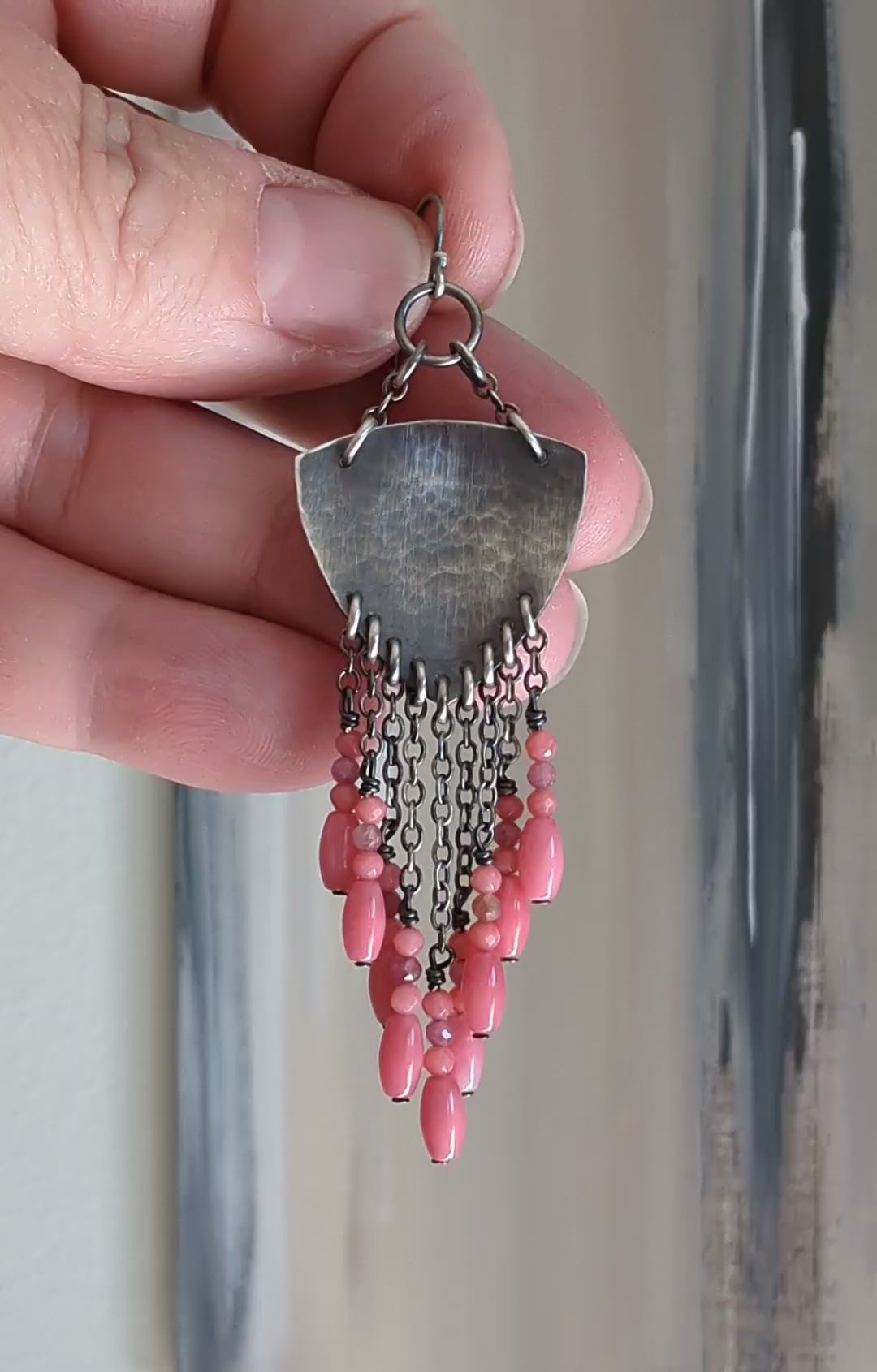 Video of statement shield earrings with cascading chain and coral beads by Rebellenhaus