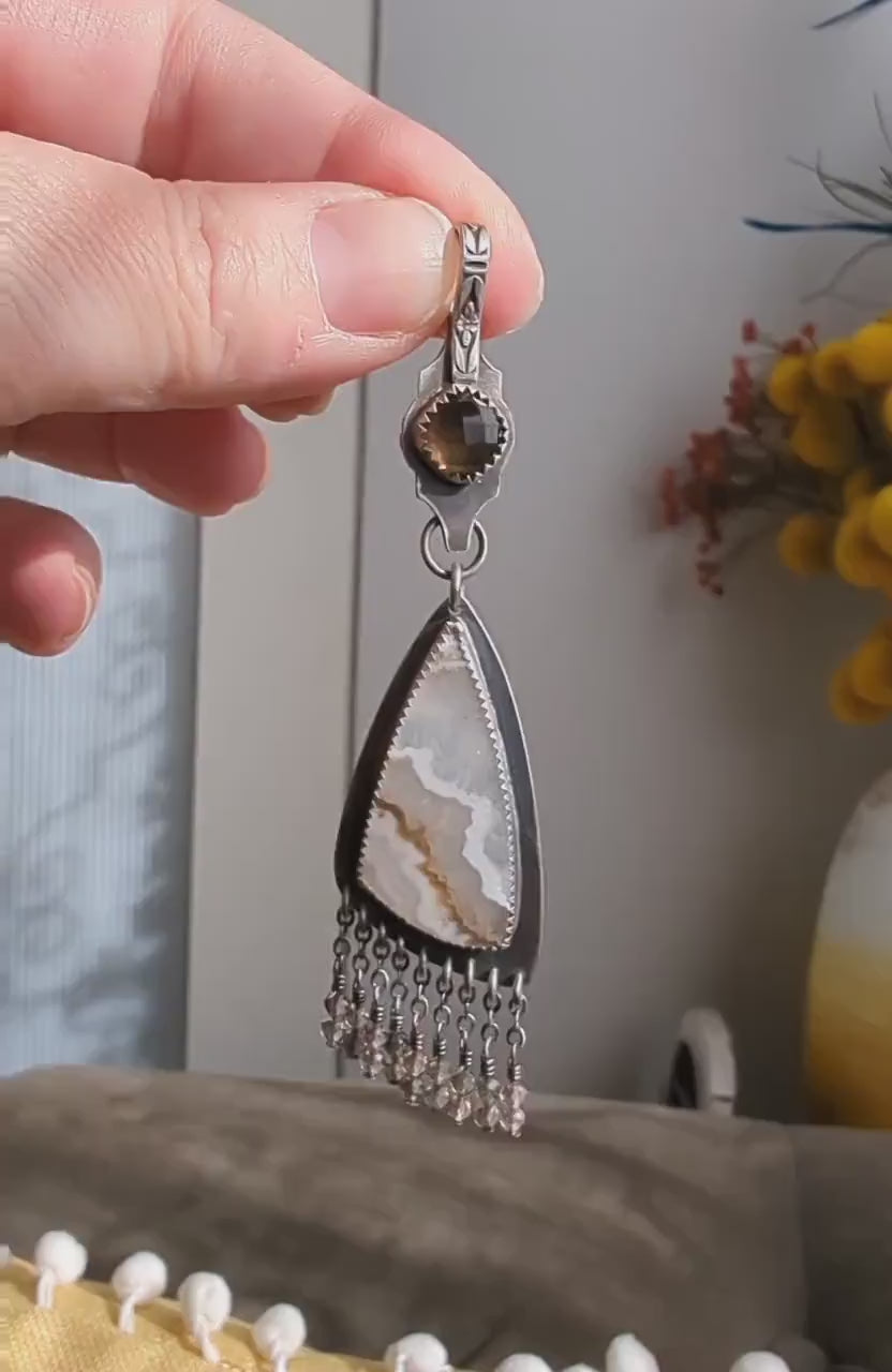 Video of collector jewelry piece with smoky quartz and white agate contrast