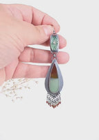 Video of one of a kind opalized wood statement earrings by Rebellenhaus