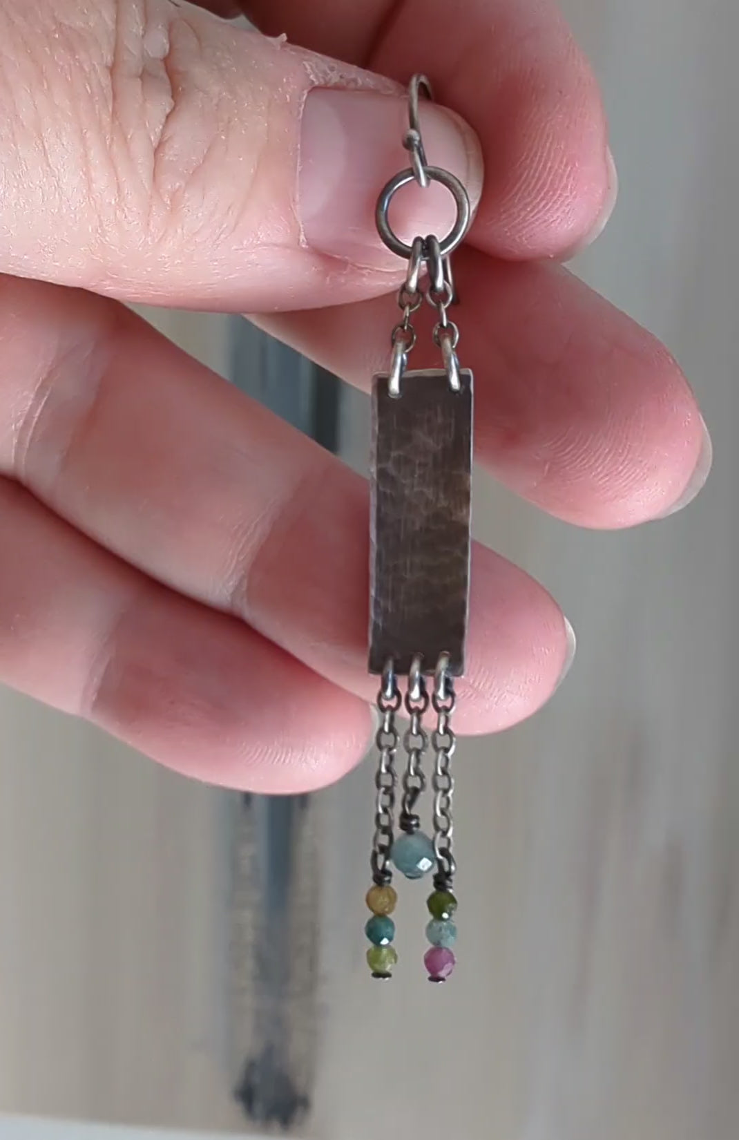 Video of long boho silver earrings with multicolor tourmaline beads by Rebellenhaus