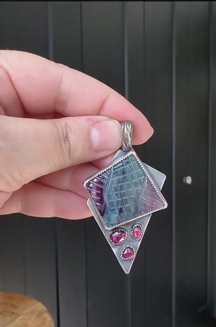 Video of rainbow fluorite and garnet multi-stone pendant from Rebellenhaus