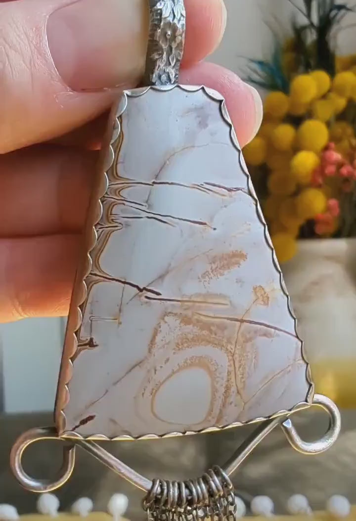 Video of rhyolite pendant with chunky filagree and fringe