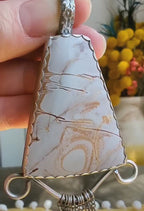Video of rhyolite pendant with chunky filagree and fringe
