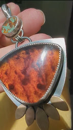 Video of one of a kind turquoise and amber gemstone pendant by Rebellenhaus