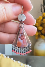 Video of bold tropical gemstone earrings with silver coin drop design