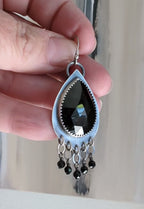 Video of bold artisan earrings with black spinel and silver movement