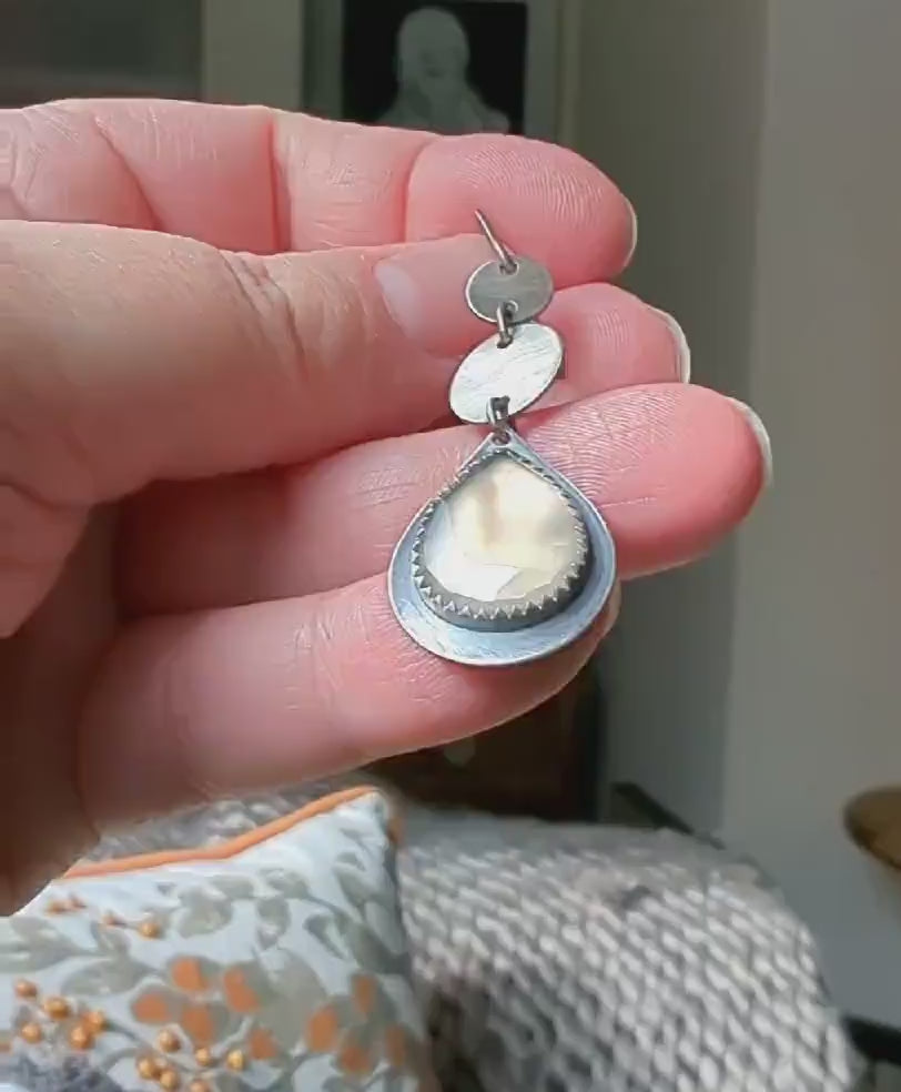 Video of Lightweight artisan silver earrings with calming elegance