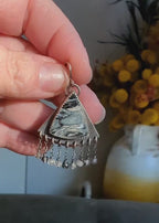Video of handcrafted palm root and rutile quartz earrings by Rebellenhaus