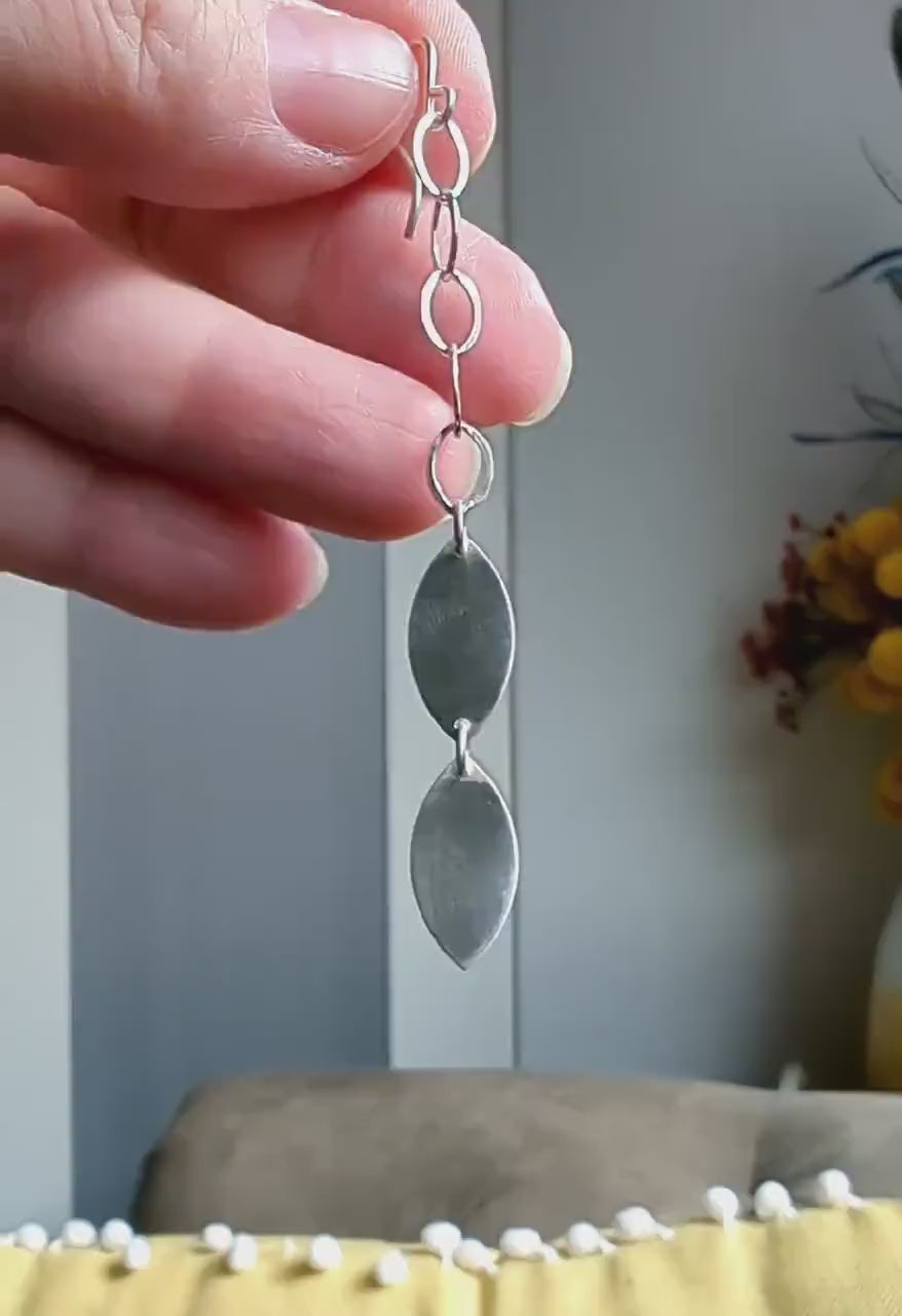 Video of elegant satin and high-polish silver statement earrings