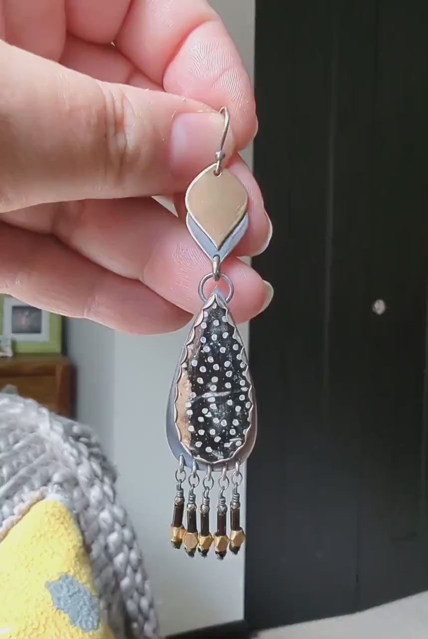 Video of collector artisan earrings with dramatic fringe movement