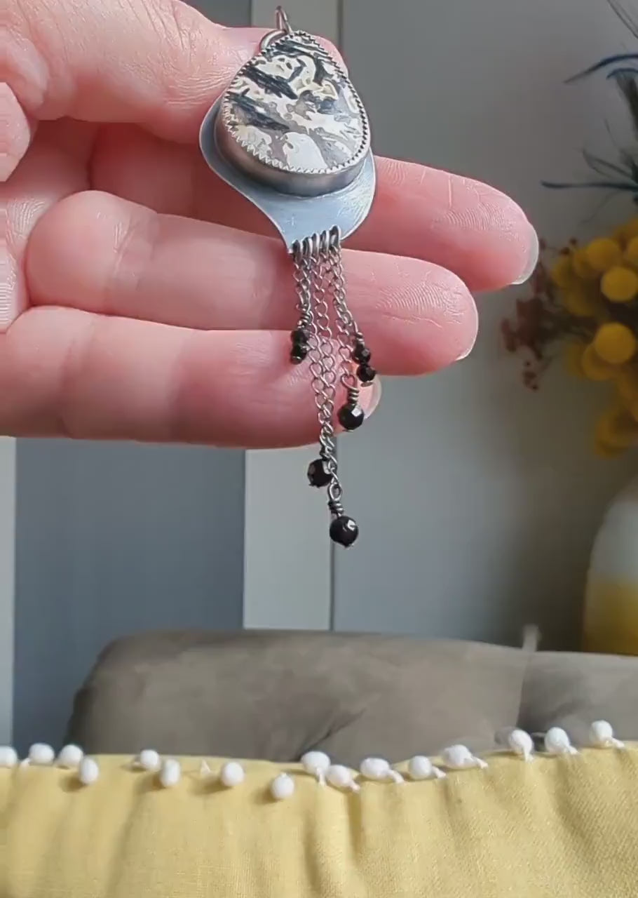 Video of palm root agate asymmetrical artisan earrings by Rebellenhaus