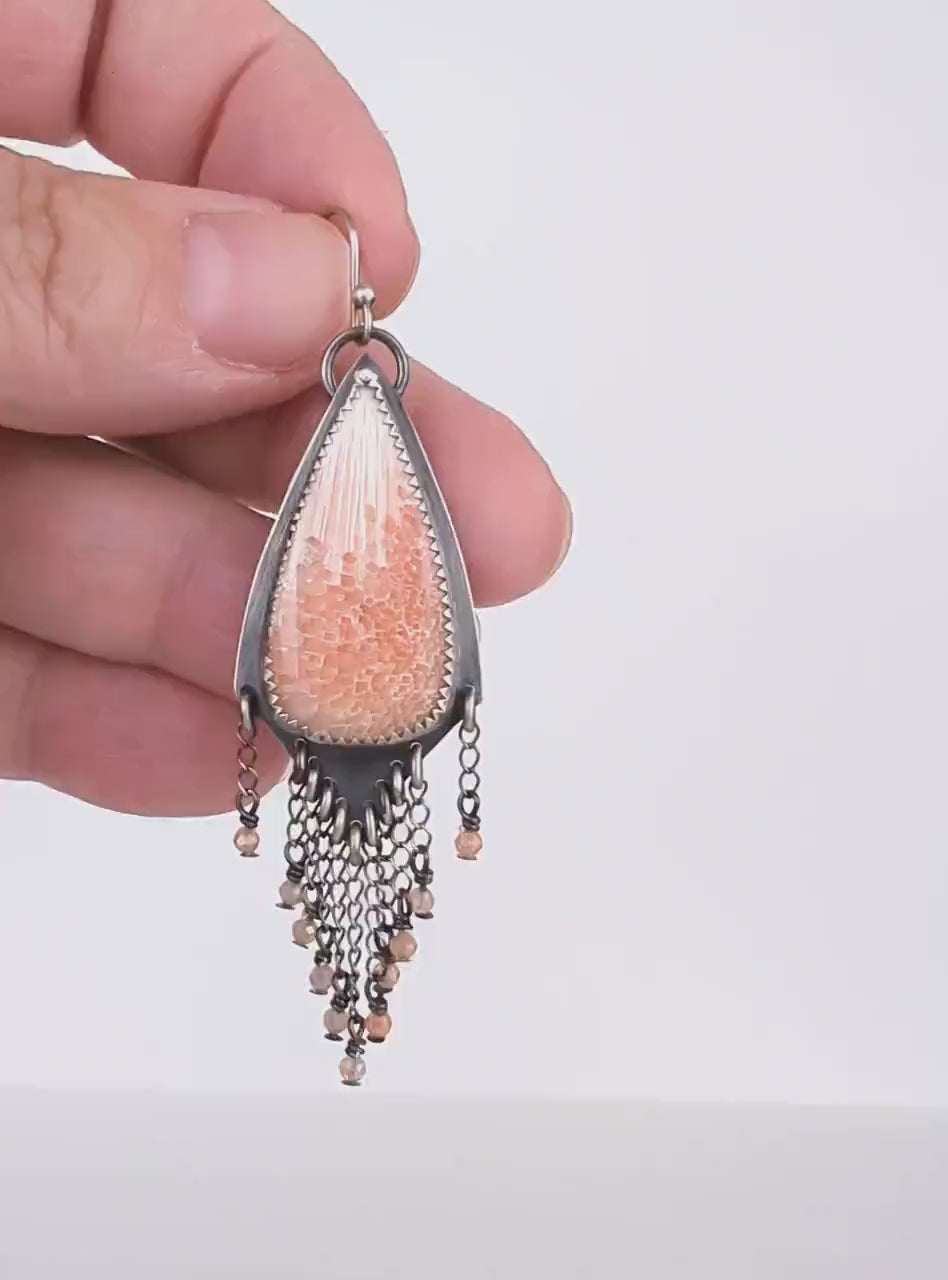 Video of one of a kind peach scolecite gemstone earrings by Rebellenhaus