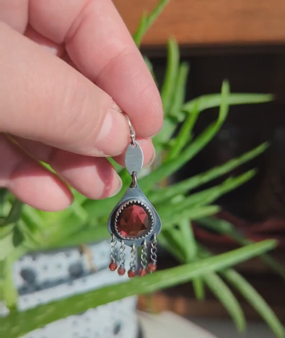 Video of one of a kind garnet birthstone earrings by Rebellenhaus