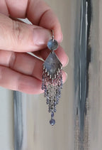 Video of statement silver earrings with cascading beaded strands by Rebellenhaus