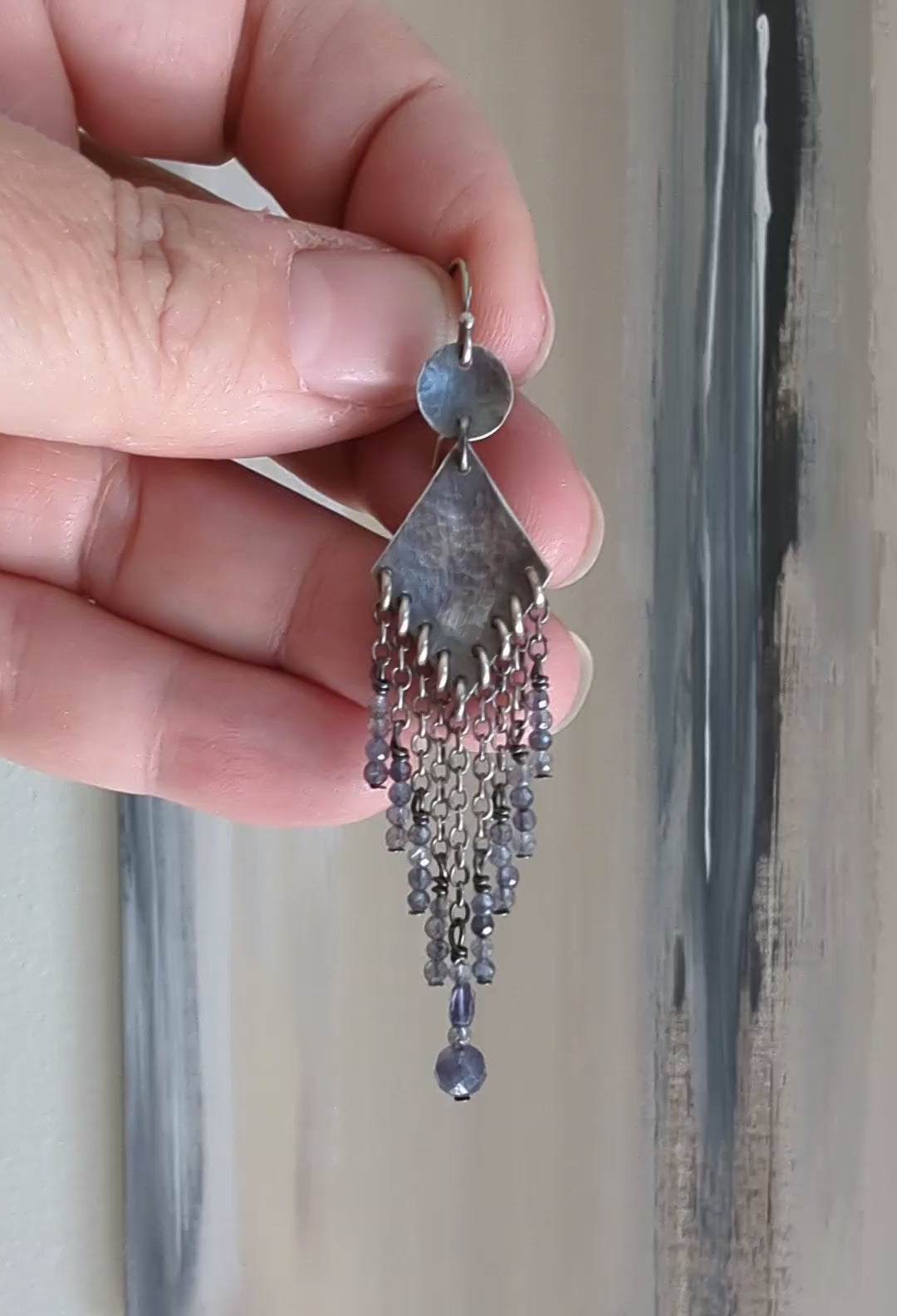 Video of statement silver earrings with cascading beaded strands by Rebellenhaus