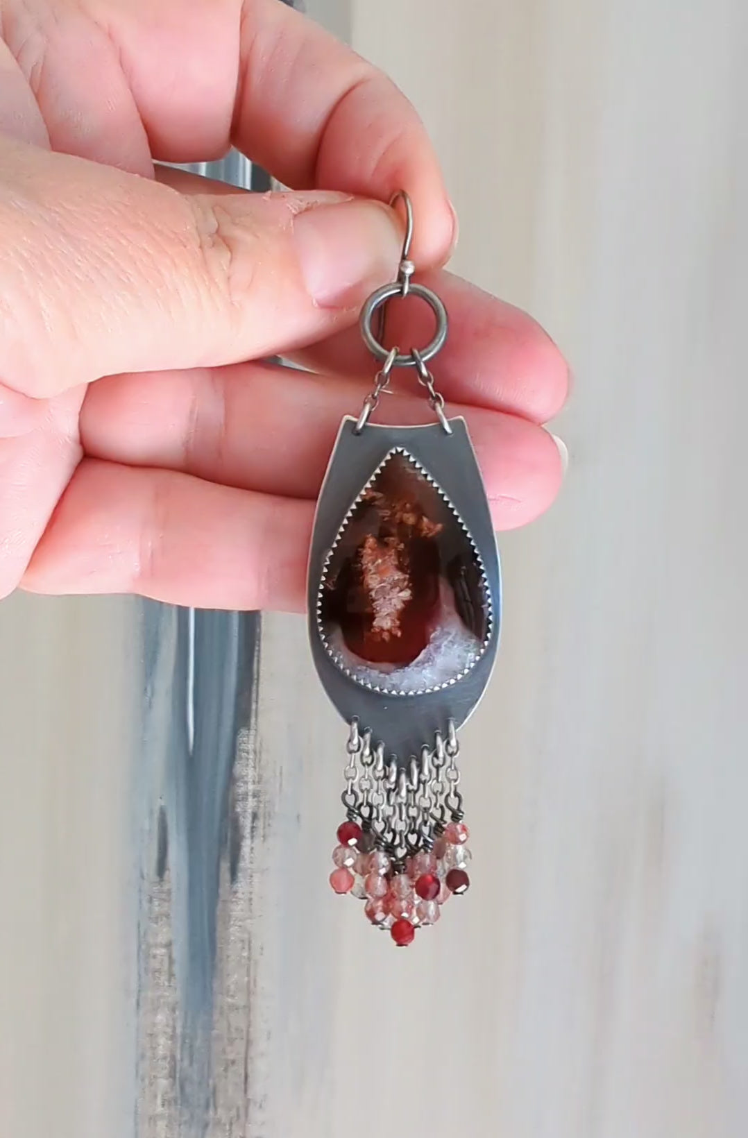 video of  unique gemstone earrings with vivid red pink and white colors